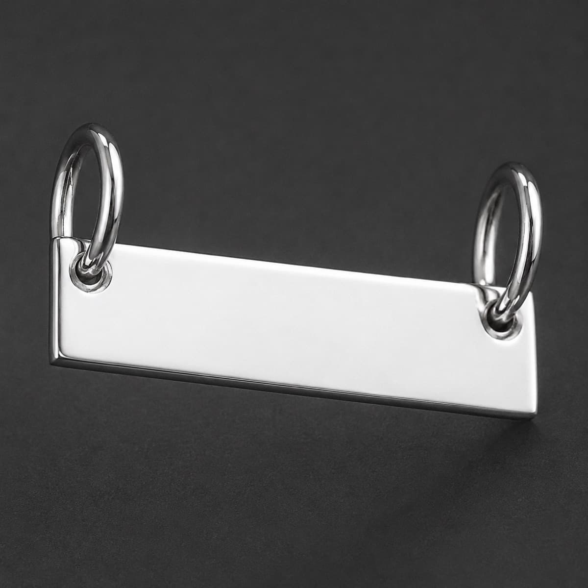 Bar Charm 20 mm in solid 925 sterling silver, photographed against a dark grey background