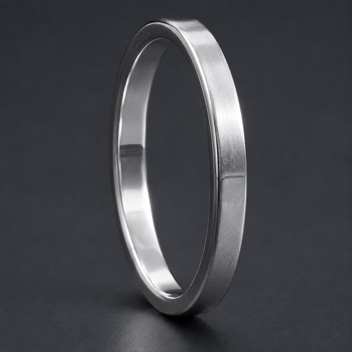 Plain Band 2 mm in solid 925 sterling silver, photographed against a dark grey background