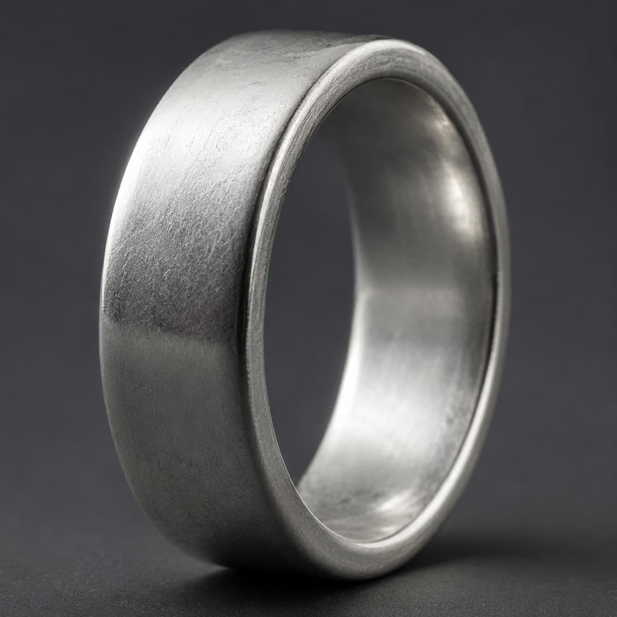 Plain Band 6 mm in solid 925 sterling silver, photographed against a dark grey background