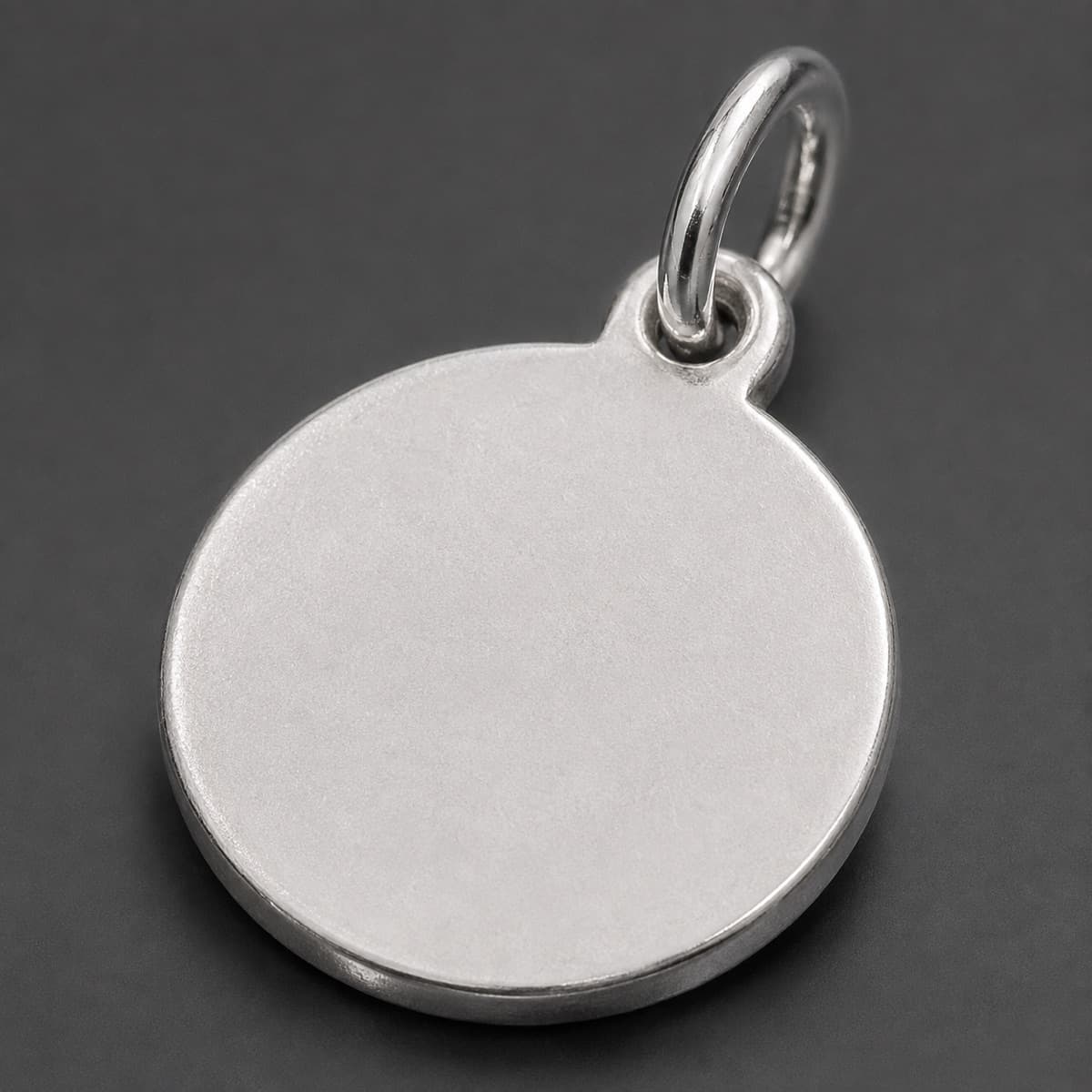 Plain Disc Charm 12 mm in solid 925 sterling silver, photographed against a dark grey background