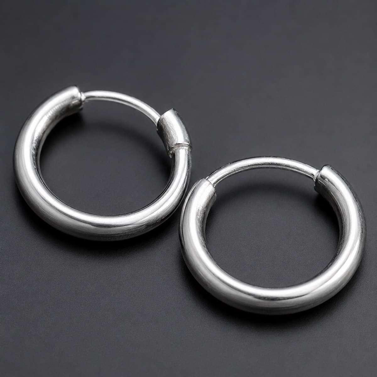 Small Hoop 12 mm Pair in solid 925 sterling silver, photographed against a dark grey background