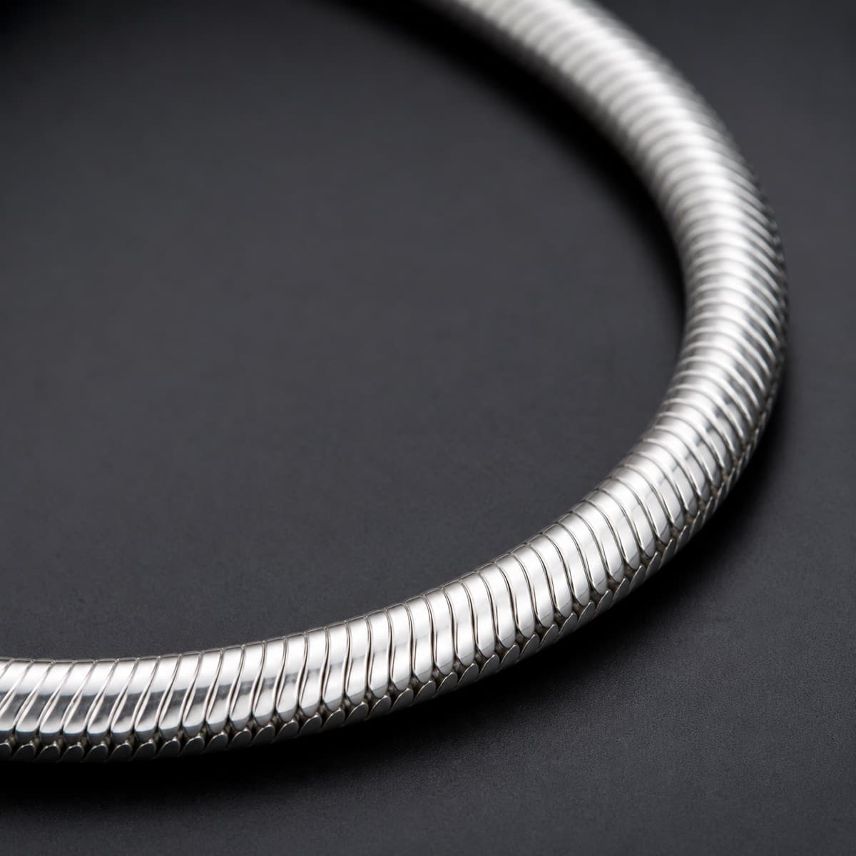 Snake Chain 1.8 mm in solid 925 sterling silver, photographed against a dark grey background