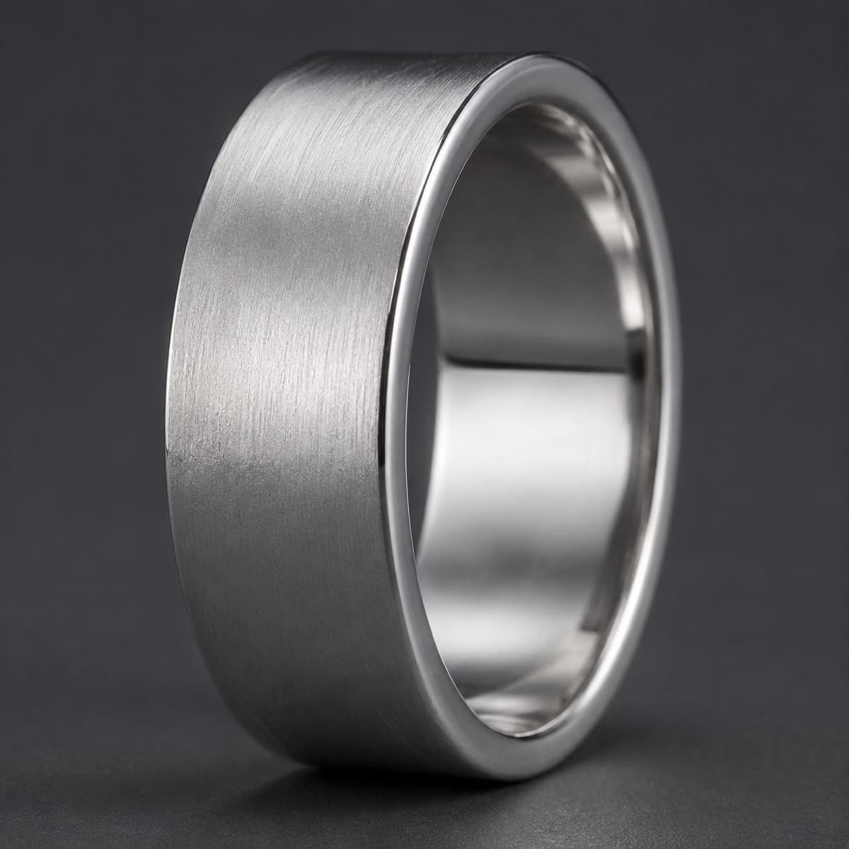 Thumb Ring 5 mm in solid 925 sterling silver, photographed against a dark grey background